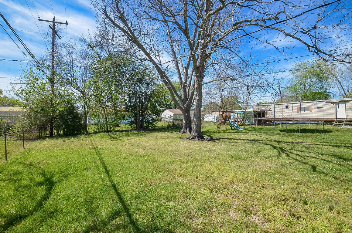 201 Inwood Lane Highlands, TX 77562 - Photo 27 of 31 a view of yard with basketball court