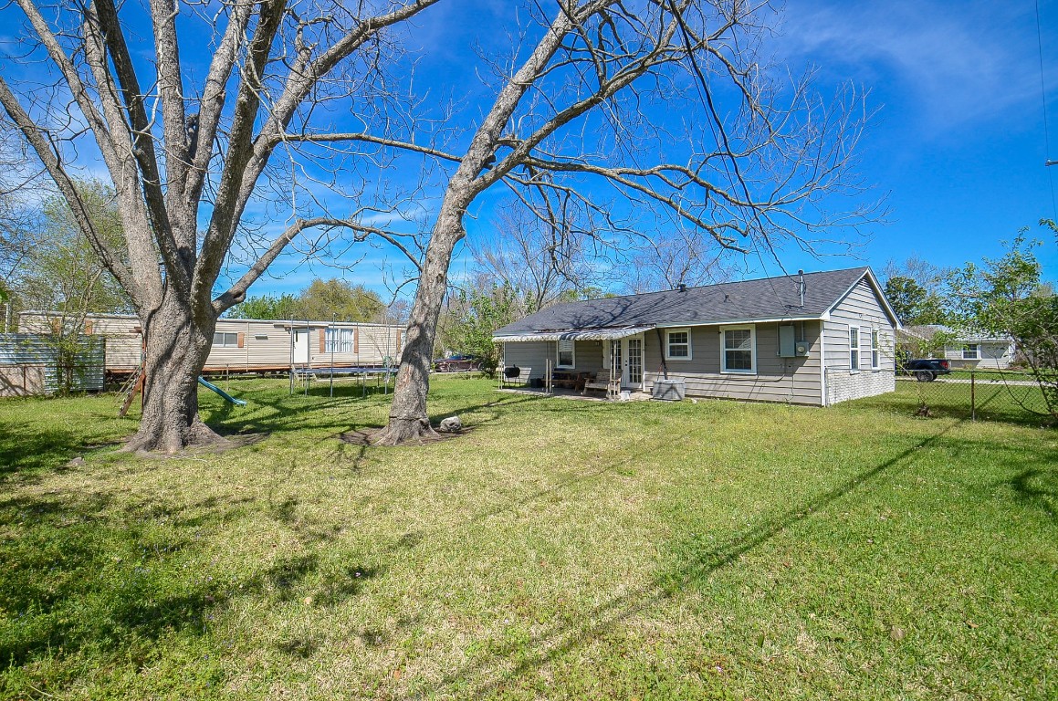 201 Inwood Lane Highlands, TX 77562 - Photo 28 of 31 a front view of a house with garden