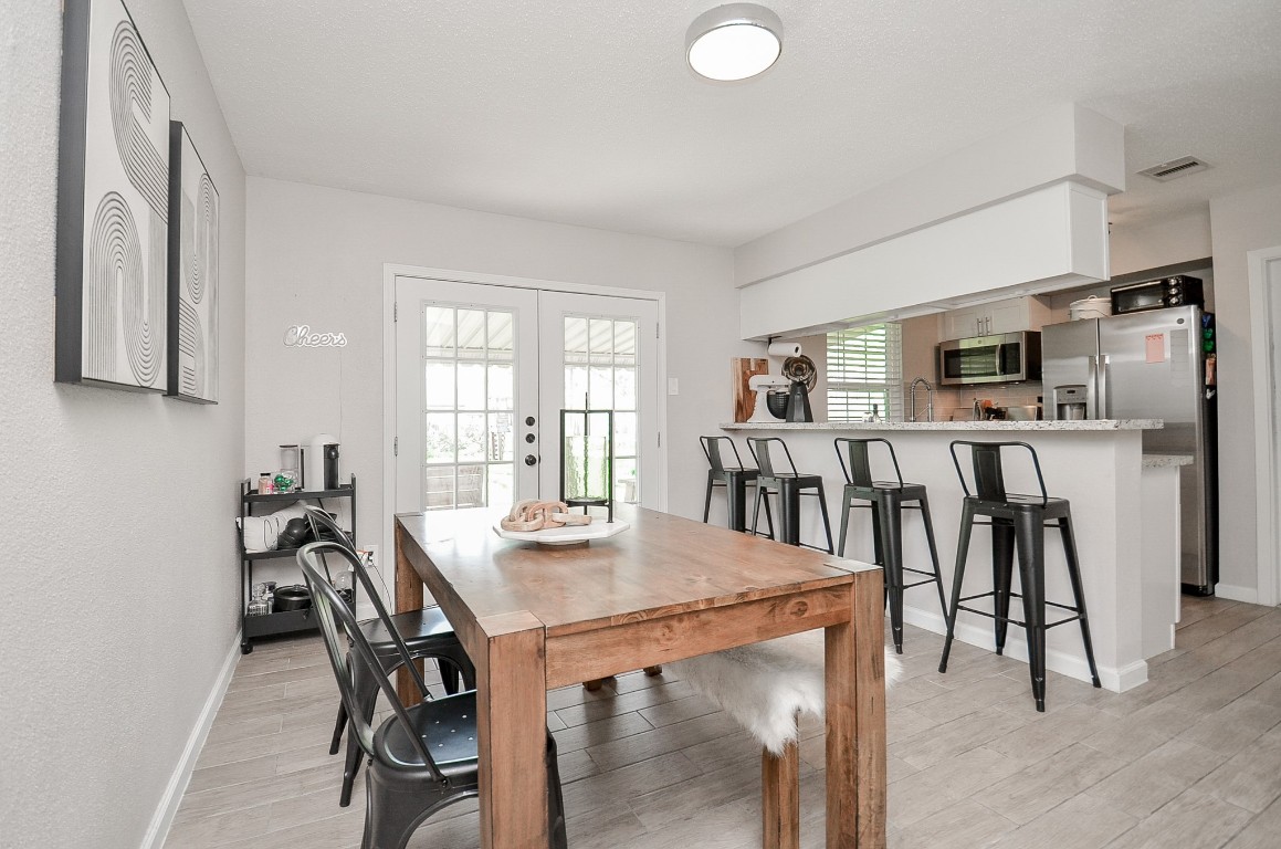 201 Inwood Lane Highlands, TX 77562 - Photo 8 of 31 a view of a dining room with furniture