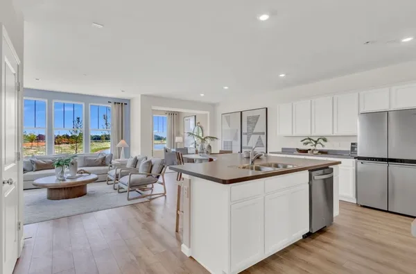 a kitchen with sink and cabinets