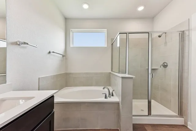 a bathroom with a bathtub and a shower
