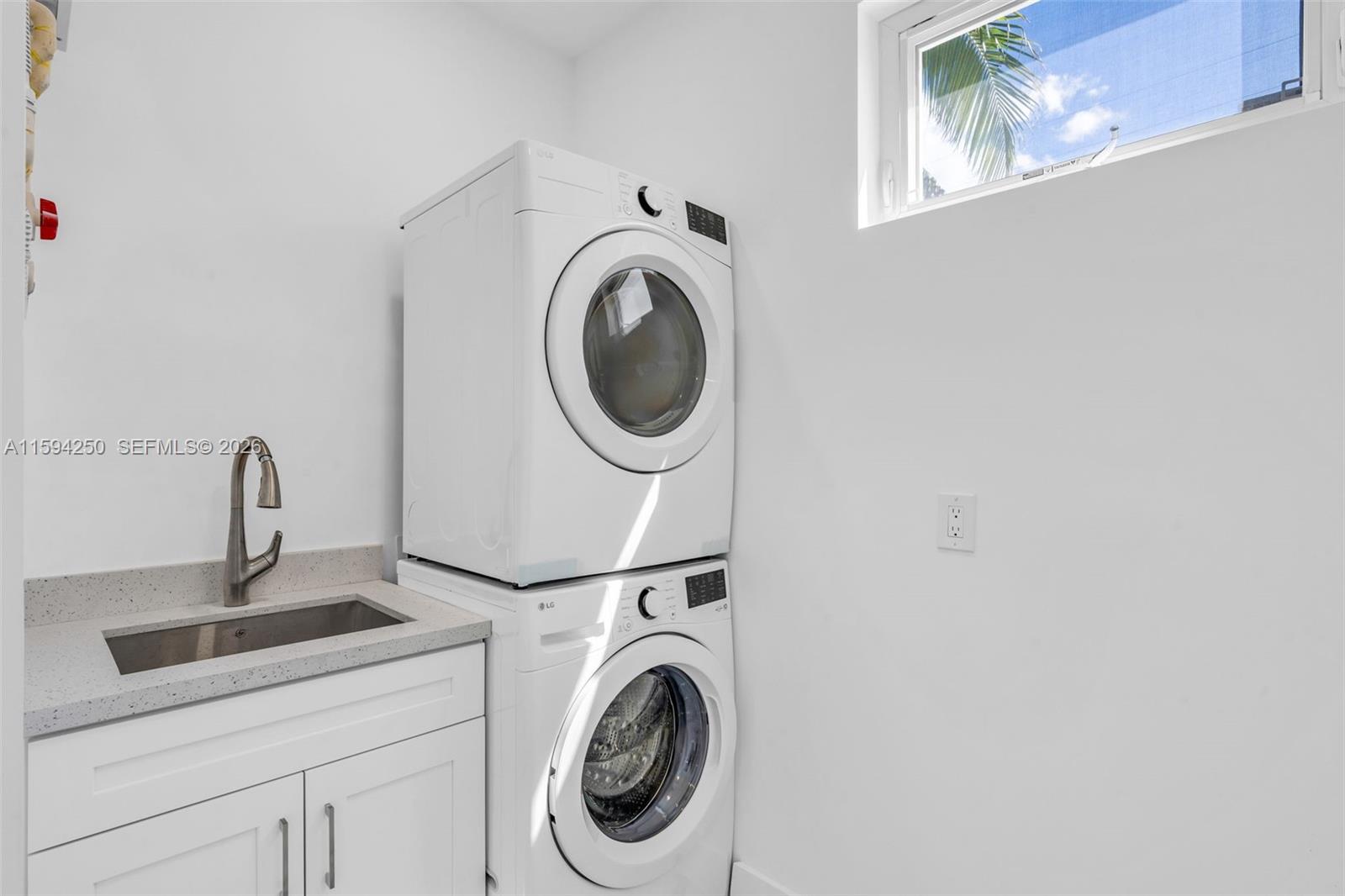 84 Coral Way Key Largo, FL 33037 - Photo 20 of 55 a utility room with dryer and washer