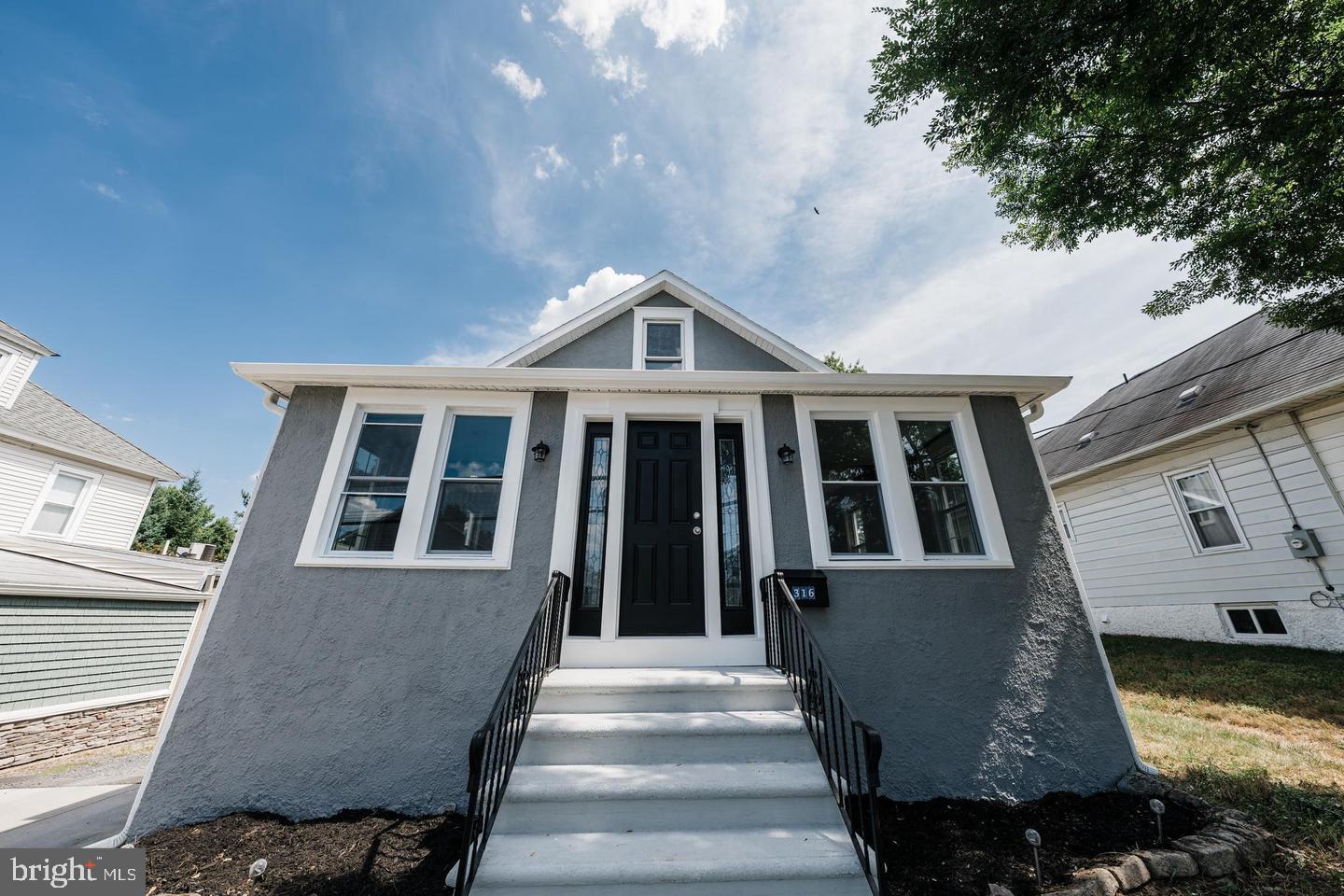 316 Clements Bridge Road Barrington, NJ 08007 - Photo 2 of 36 Charming gray facade with inviting steps.