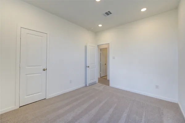 a bathroom with a granite countertop sink toilet a mirror and bathtub