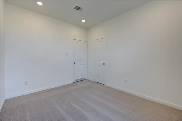 a kitchen with a stove and a refrigerator