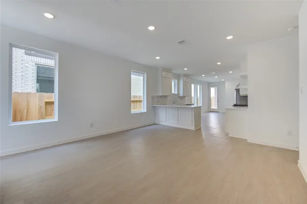 a view of kitchen with kitchen island sink and center island