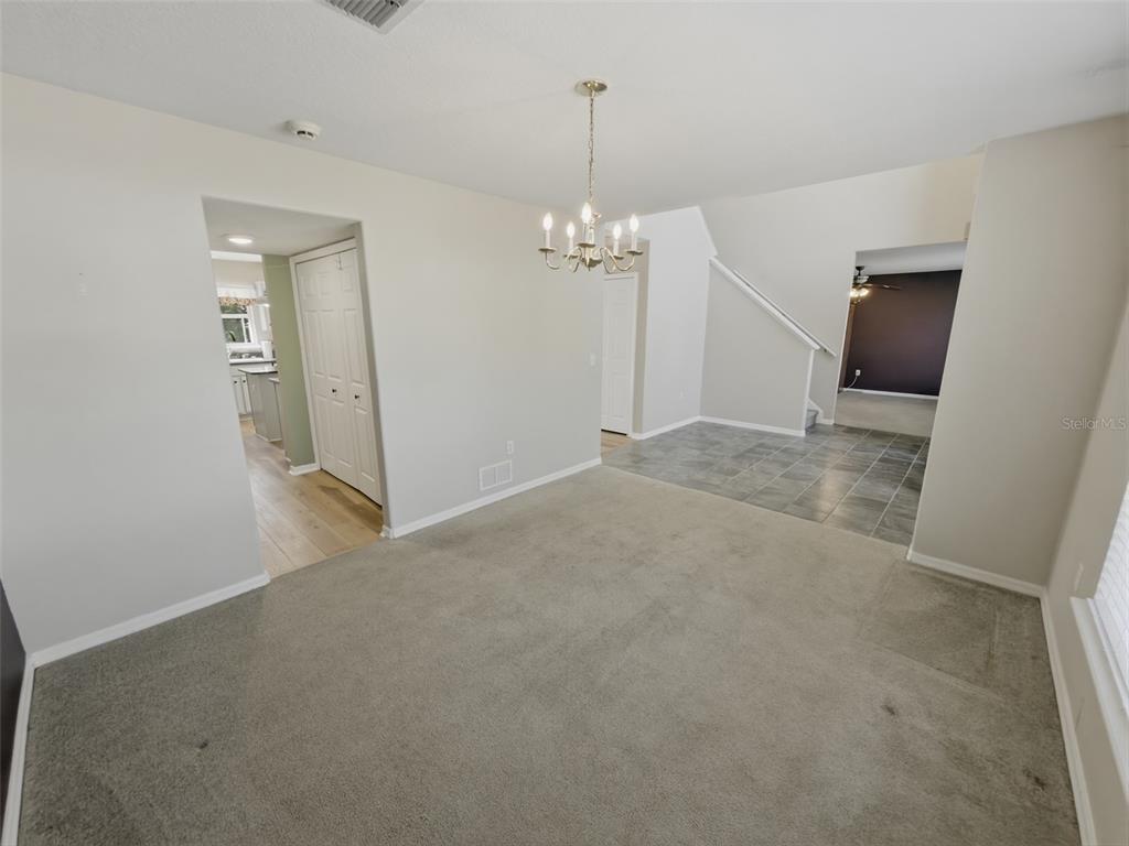13302 Mitten Lane Spring Hill, FL 34609 - Photo 11 of 59 a view of a livingroom with a chandelier