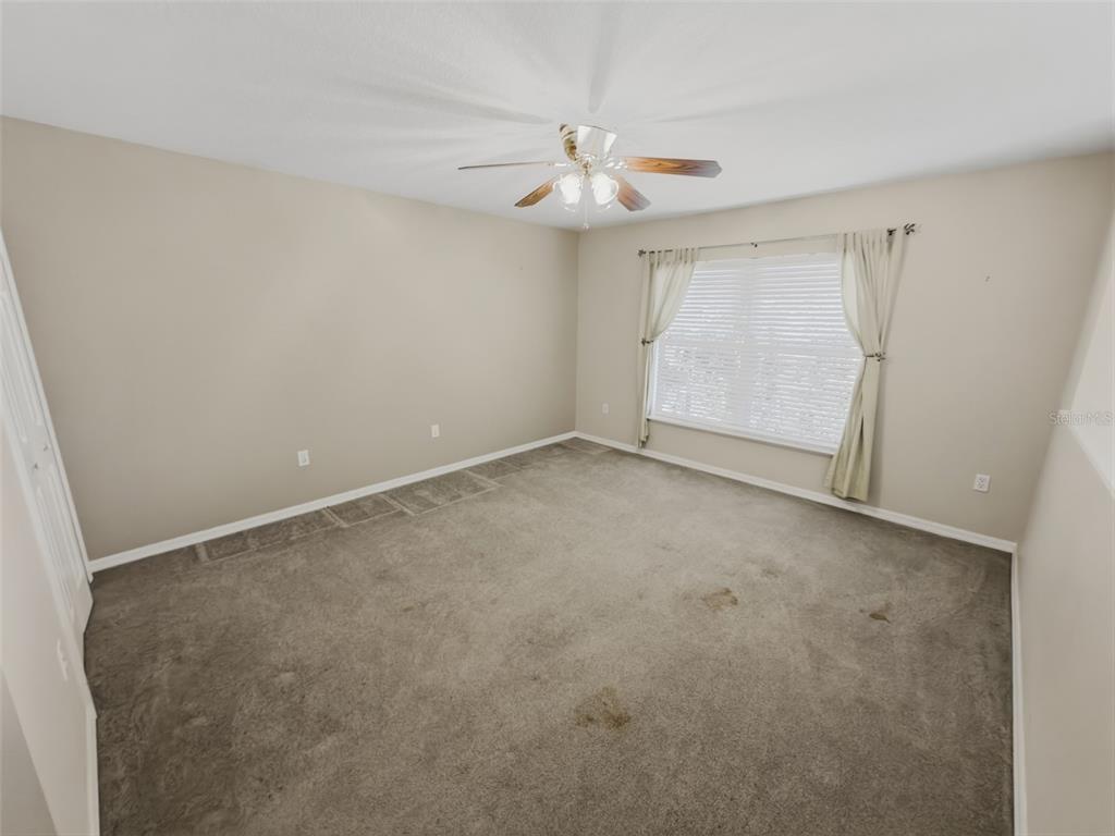 13302 Mitten Lane Spring Hill, FL 34609 - Photo 28 of 59 a view of an empty room with a window