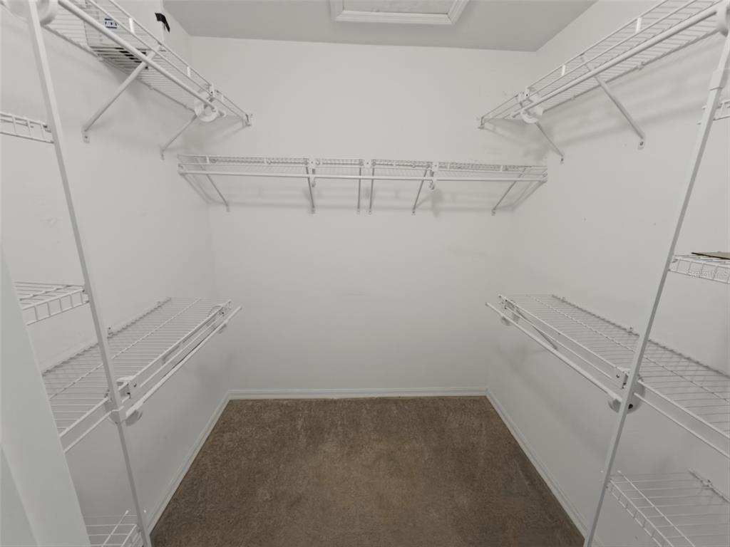 13302 Mitten Lane Spring Hill, FL 34609 - Photo 31 of 59 a view of a room with racks on the wall