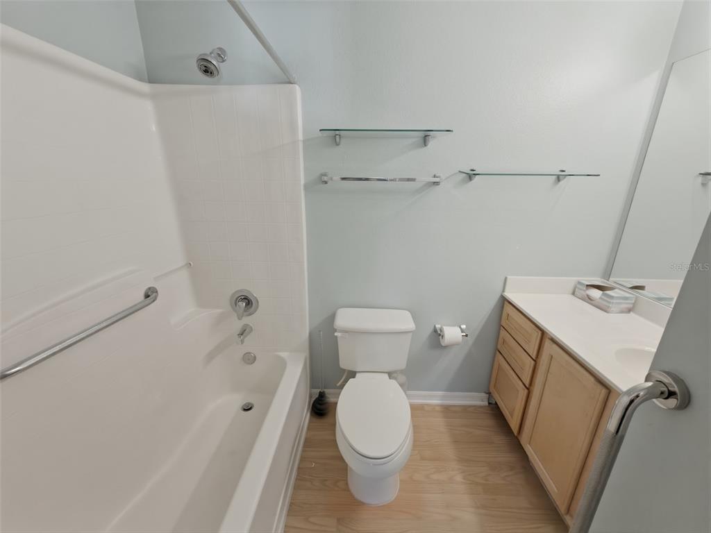 13302 Mitten Lane Spring Hill, FL 34609 - Photo 38 of 59 a bathroom with a sink a toilet and shower