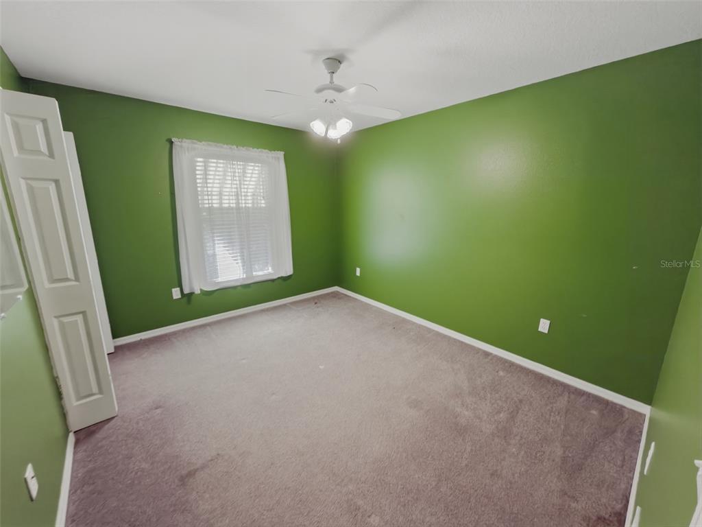13302 Mitten Lane Spring Hill, FL 34609 - Photo 41 of 59 a view of empty room with window and fireplace