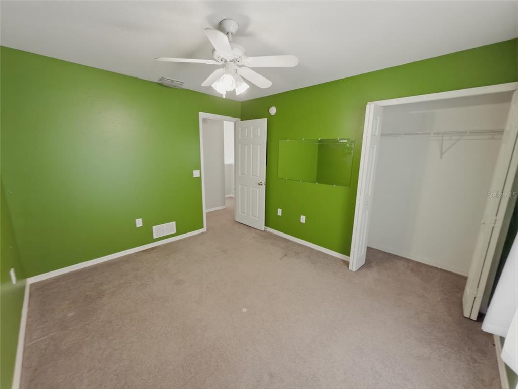 13302 Mitten Lane Spring Hill, FL 34609 - Photo 42 of 59 a view of room with a fan and a window