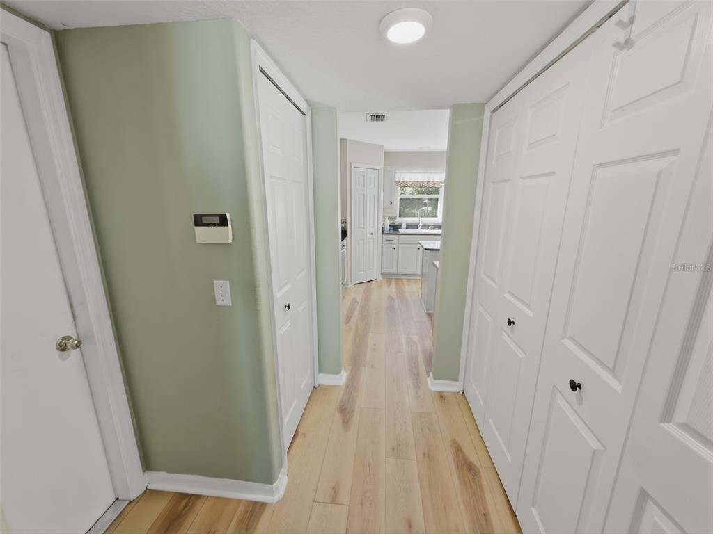 13302 Mitten Lane Spring Hill, FL 34609 - Photo 54 of 59 a view of a hallway with wooden floor and staircase
