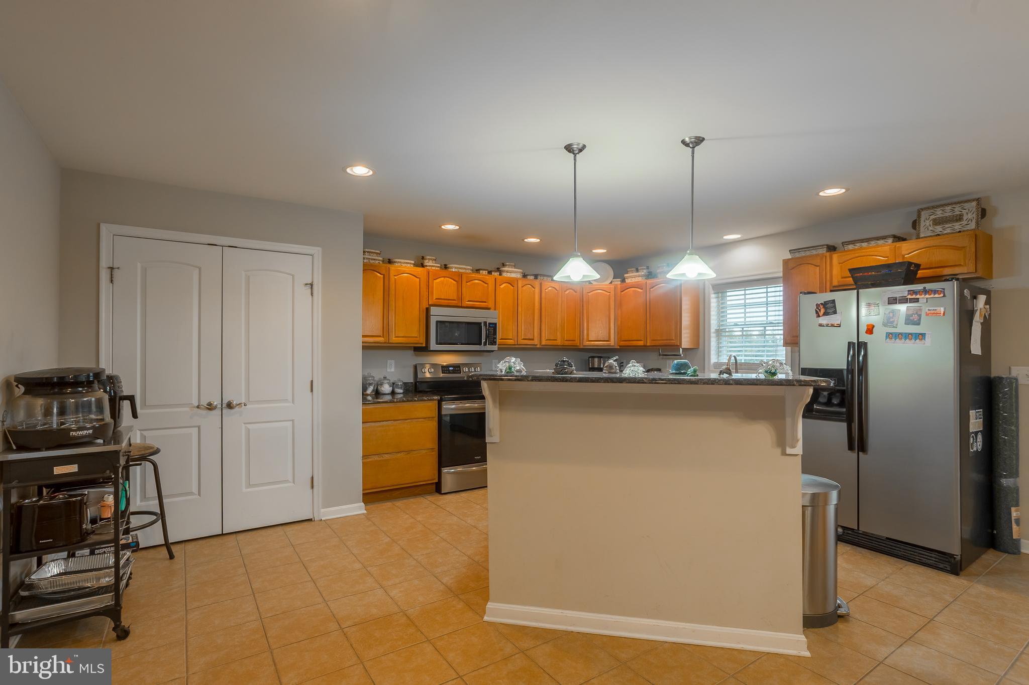 10455 Sunnyside Road Greenwood, DE 19950 - Photo 13 of 46 a view of a kitchen with a refrigerator