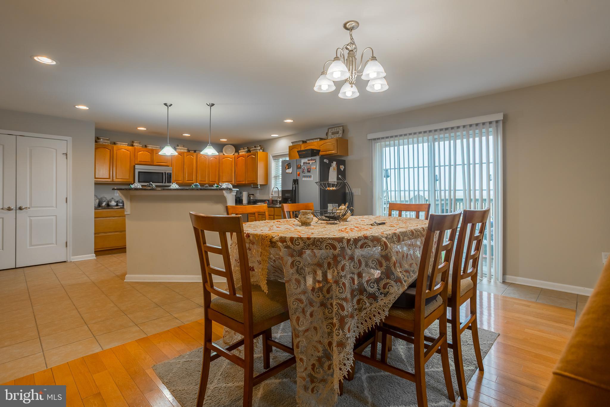 10455 Sunnyside Road Greenwood, DE 19950 - Photo 18 of 46 a dining area with furniture and chandelier