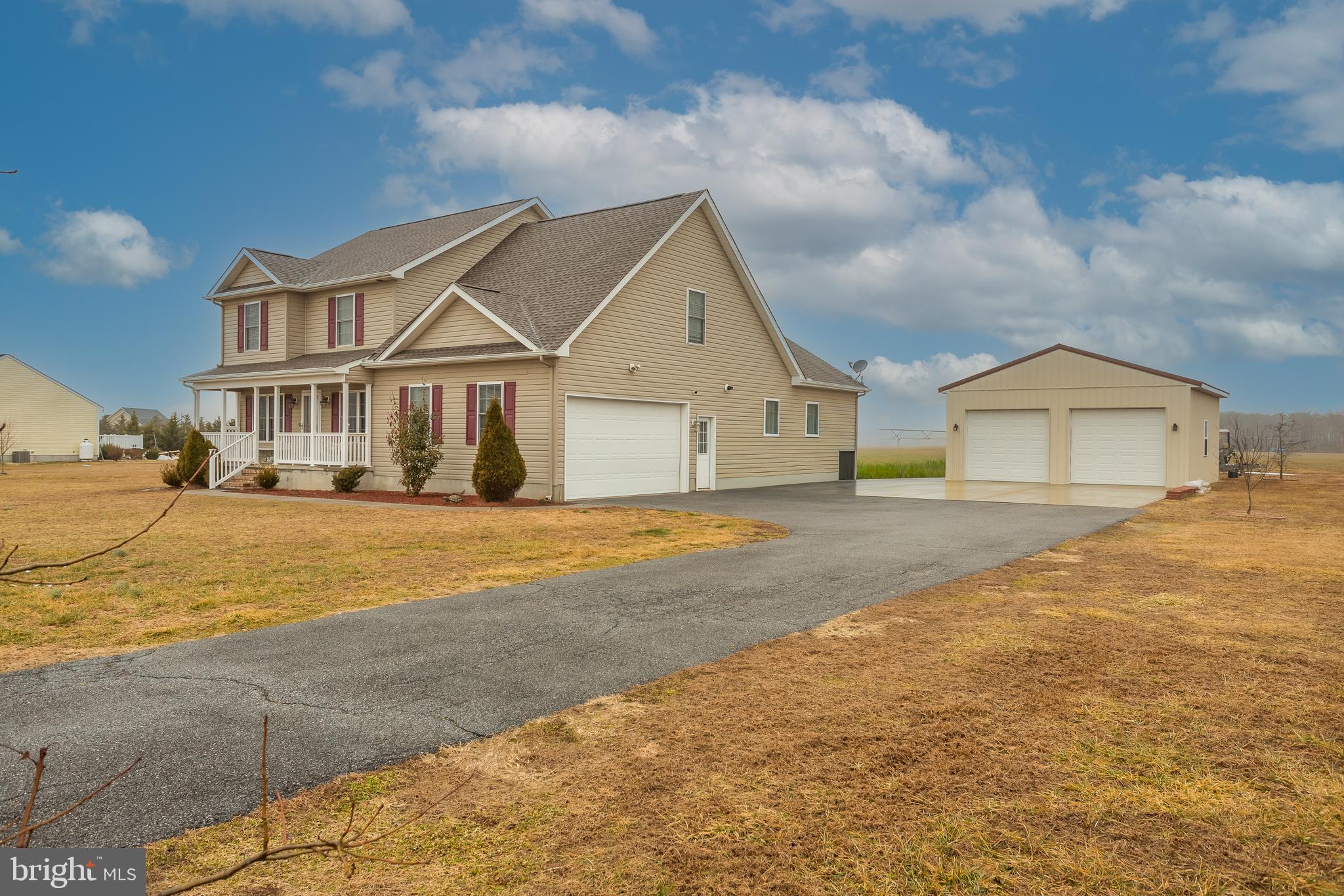 10455 Sunnyside Road Greenwood, DE 19950 - Photo 2 of 46 a front view of a house with a yard