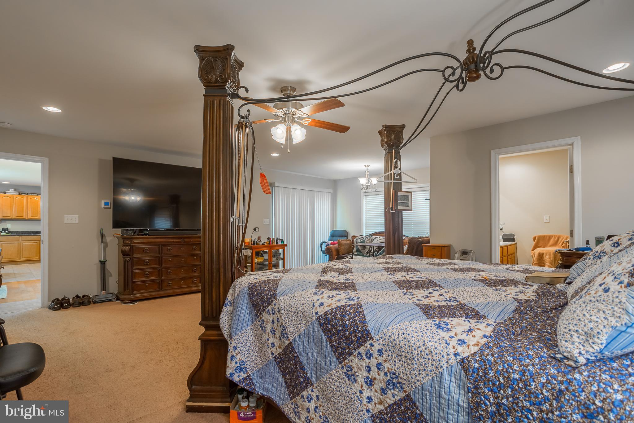 10455 Sunnyside Road Greenwood, DE 19950 - Photo 25 of 46 a bedroom with a bed and a flat tv screen on dresser
