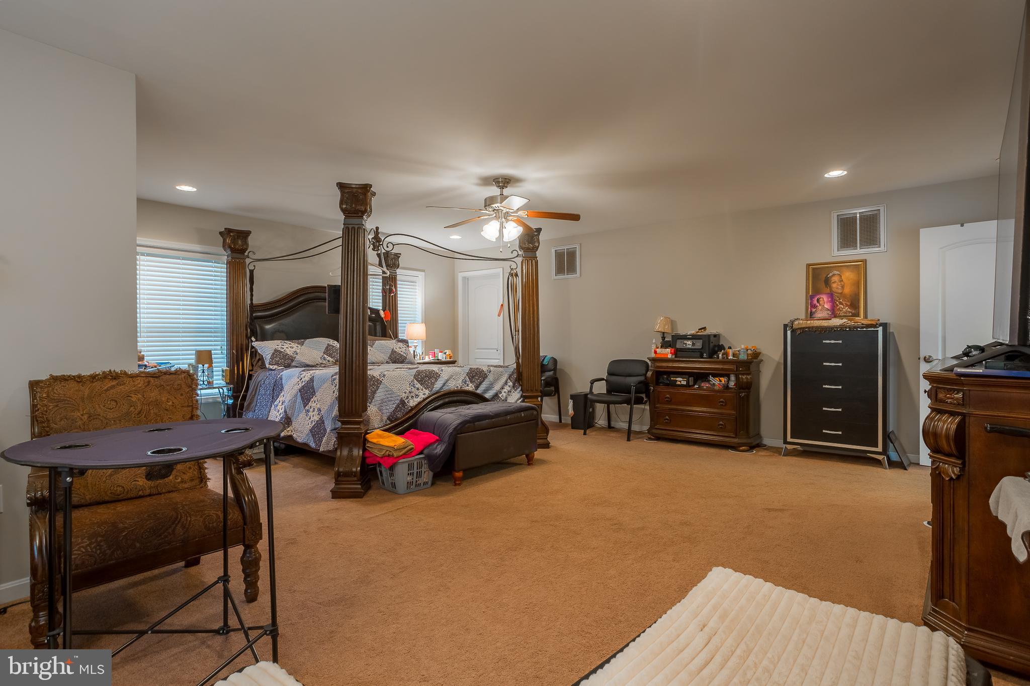 10455 Sunnyside Road Greenwood, DE 19950 - Photo 26 of 46 a bedroom with furniture and a flat screen tv