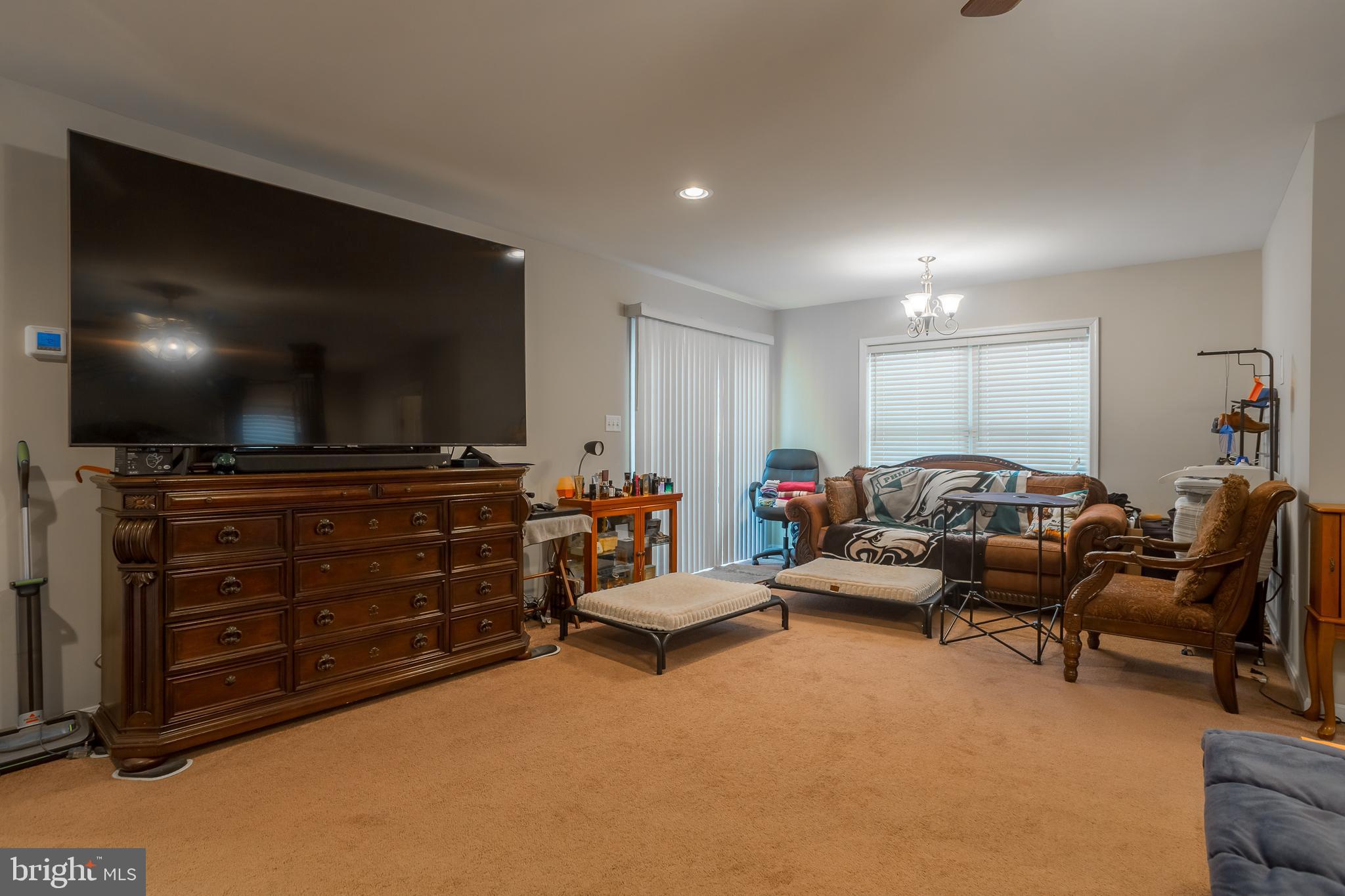 10455 Sunnyside Road Greenwood, DE 19950 - Photo 27 of 46 a living room with furniture and a flat screen tv