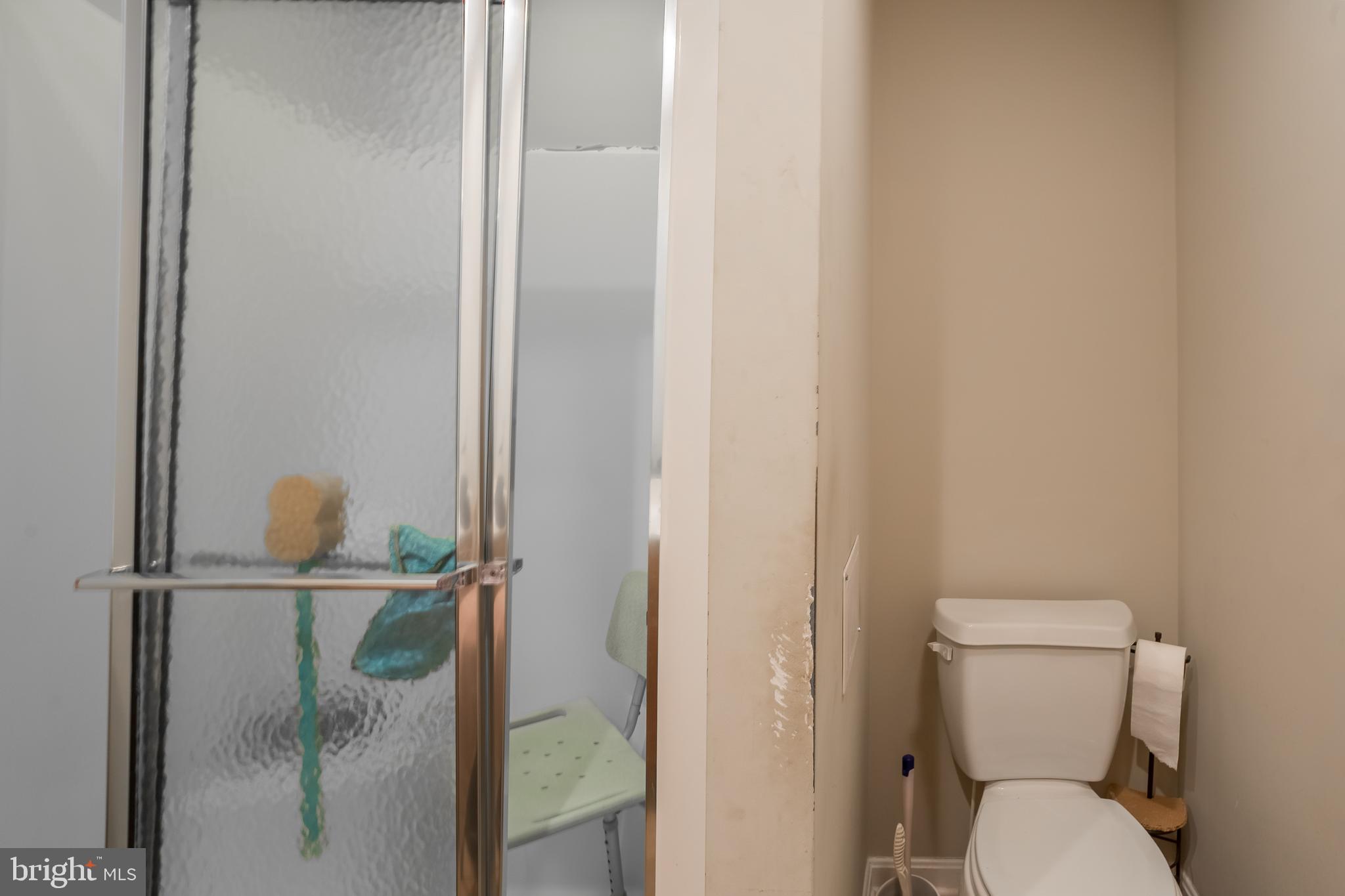 10455 Sunnyside Road Greenwood, DE 19950 - Photo 29 of 46 a bathroom with a granite countertop toilet and a sink