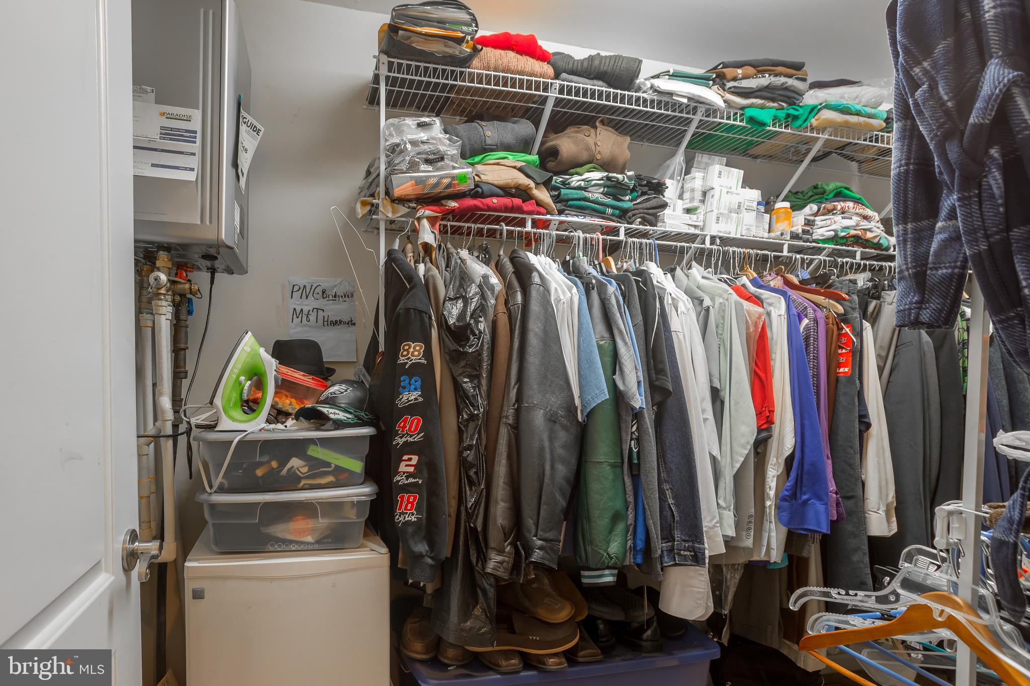 10455 Sunnyside Road Greenwood, DE 19950 - Photo 30 of 46 a view of walk in closet with clothes and shoes