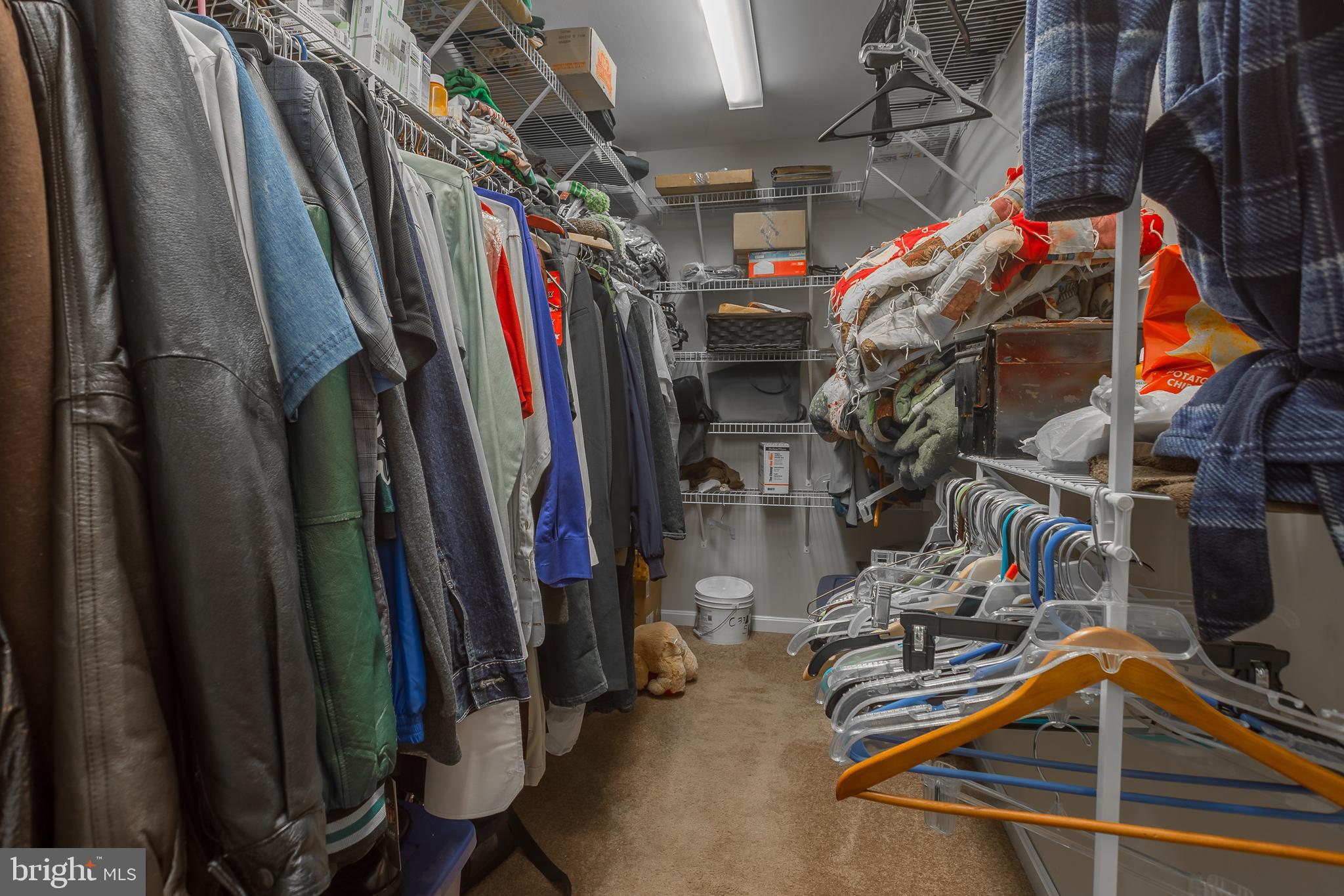 10455 Sunnyside Road Greenwood, DE 19950 - Photo 31 of 46 a view of walk in closet with clothes