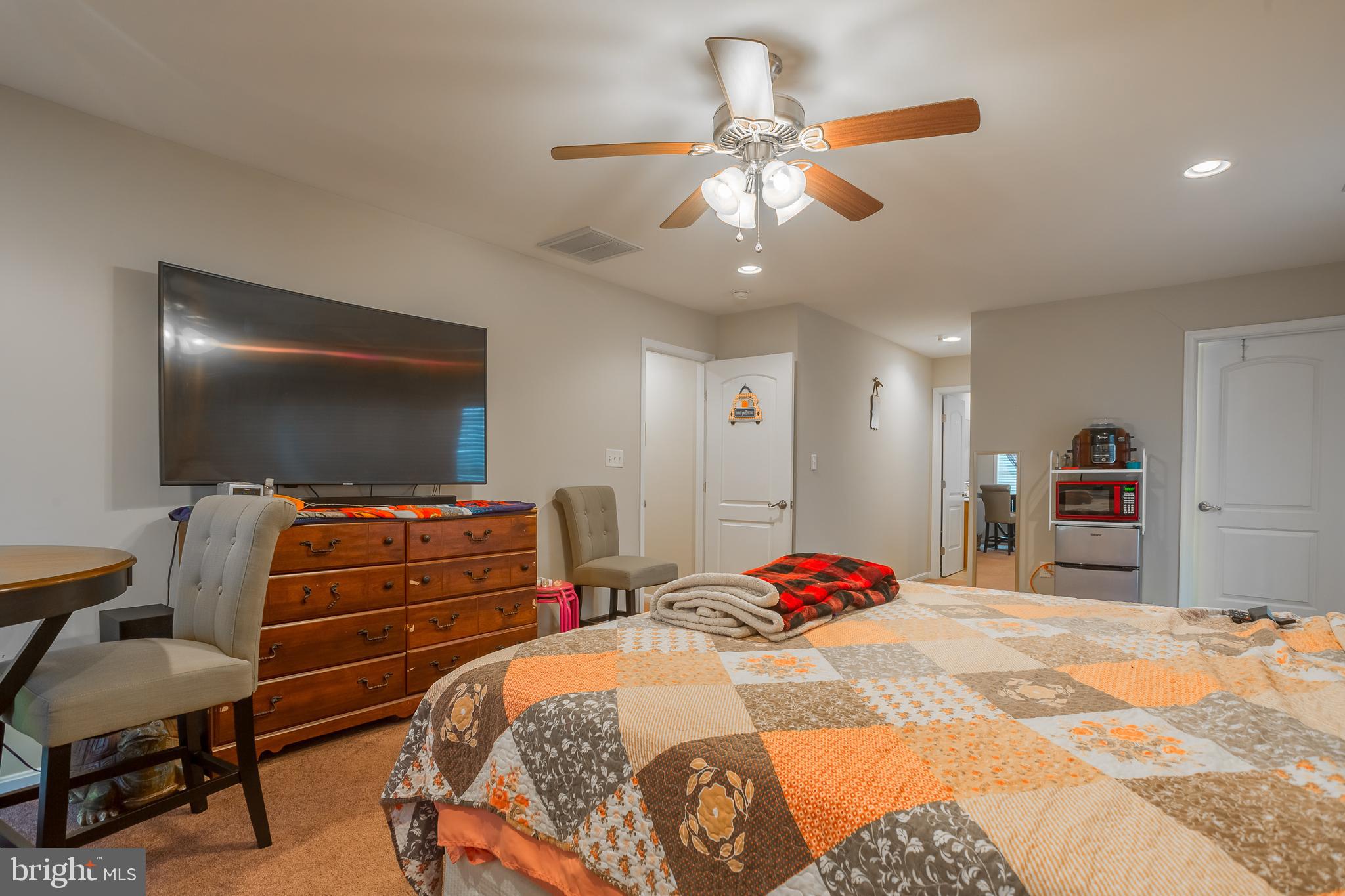 10455 Sunnyside Road Greenwood, DE 19950 - Photo 33 of 46 a bedroom with a bed and a flat screen tv