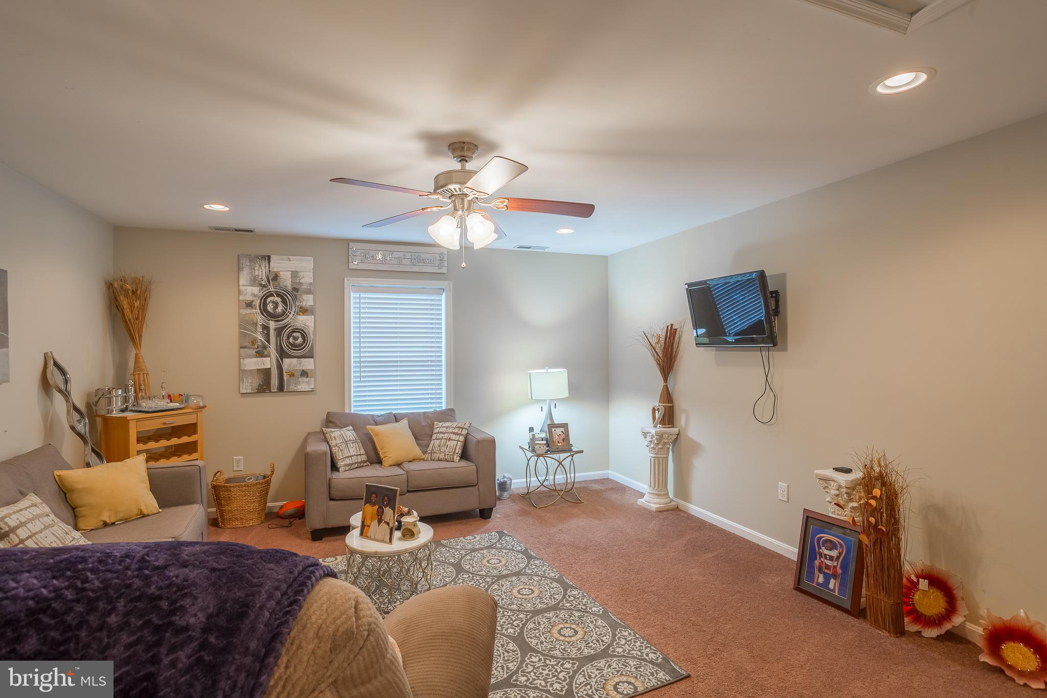 10455 Sunnyside Road Greenwood, DE 19950 - Photo 38 of 46 a living room with furniture and a flat screen tv