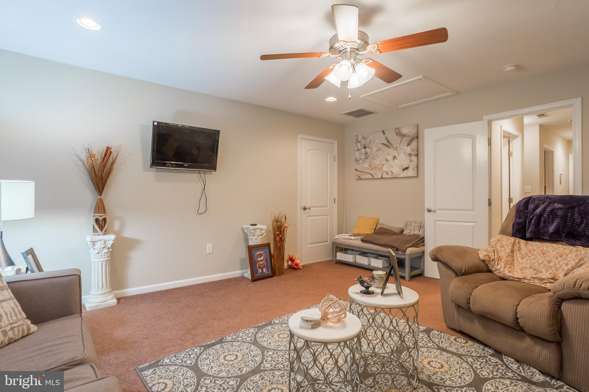 10455 Sunnyside Road Greenwood, DE 19950 - Photo 39 of 46 a living room with furniture and a flat screen tv
