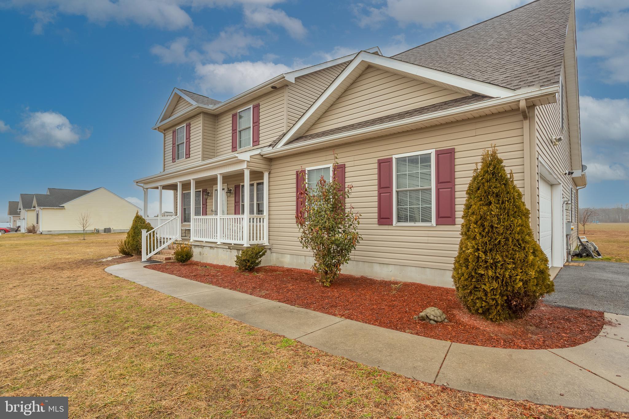 10455 Sunnyside Road Greenwood, DE 19950 - Photo 5 of 46 a front view of a house with a yard