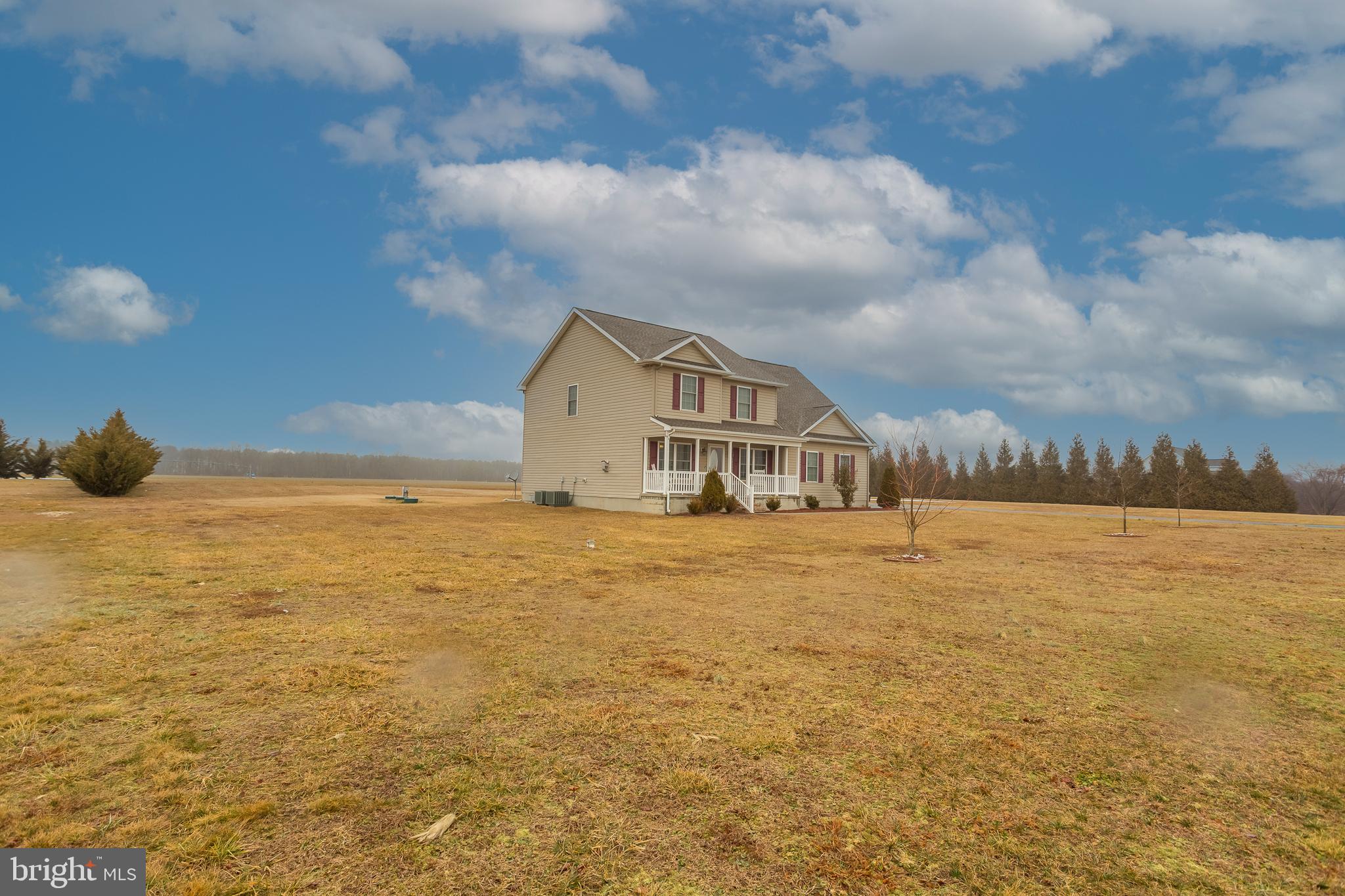 10455 Sunnyside Road Greenwood, DE 19950 - Photo 6 of 46 a view of a lake and a yard