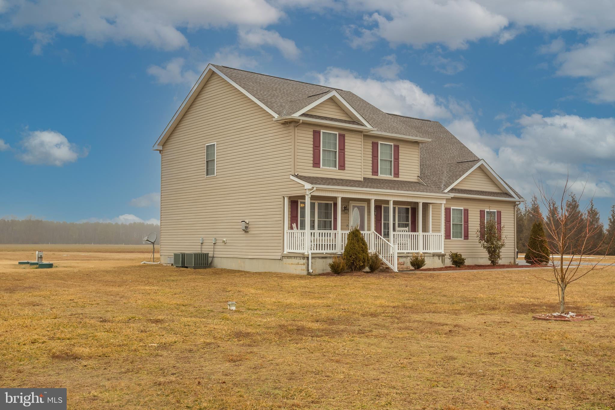 10455 Sunnyside Road Greenwood, DE 19950 - Photo 7 of 46 a front view of a house with a yard