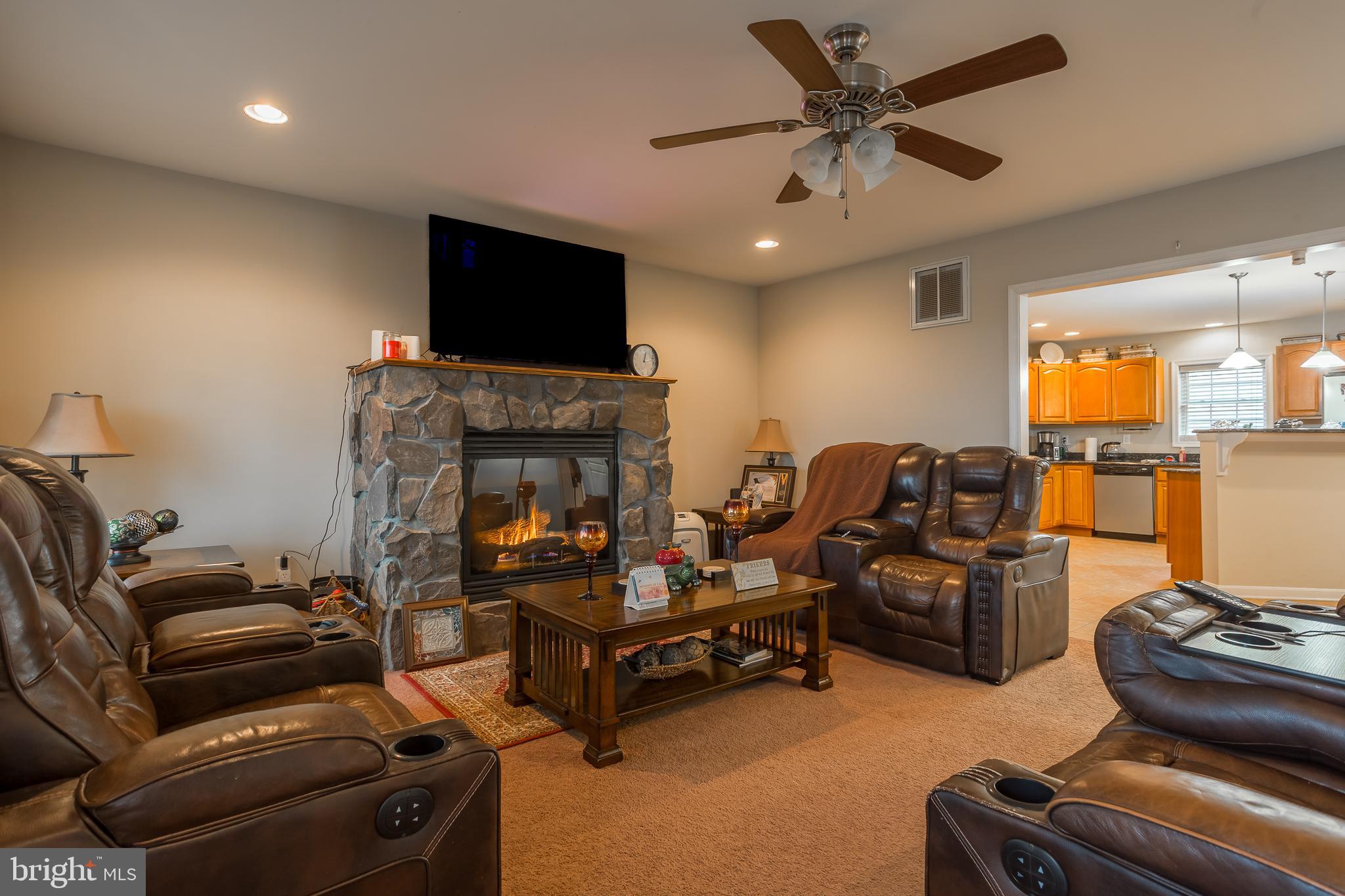 10455 Sunnyside Road Greenwood, DE 19950 - Photo 10 of 46 a living room with furniture and a flat screen tv