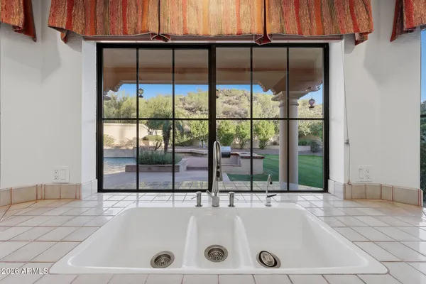 a view of an empty room with windows