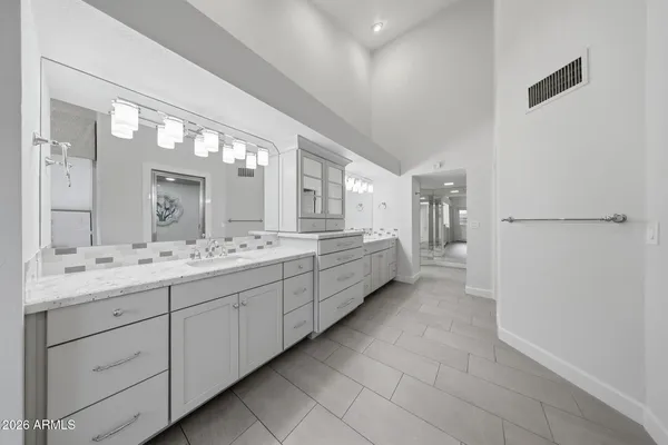 a bathroom with a bathtub and shower