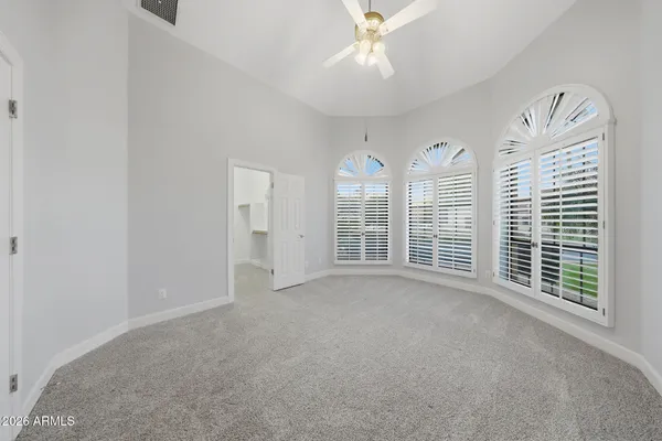 a bathroom with a double vanity sink a toilet and a mirror