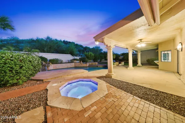 a view of a balcony with wooden floor and fence