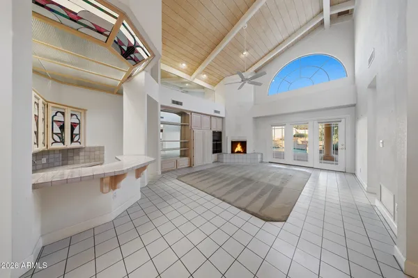 a view of living room kitchen and entryway