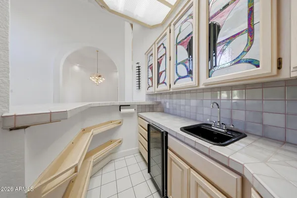 a kitchen with stainless steel appliances granite countertop a stove and cabinets