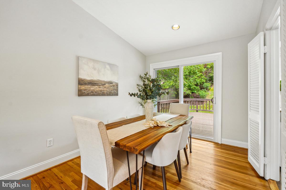 827 Caddington Avenue Silver Spring, MD 20901 - Photo 11 of 45 a dining room with furniture and wooden floor