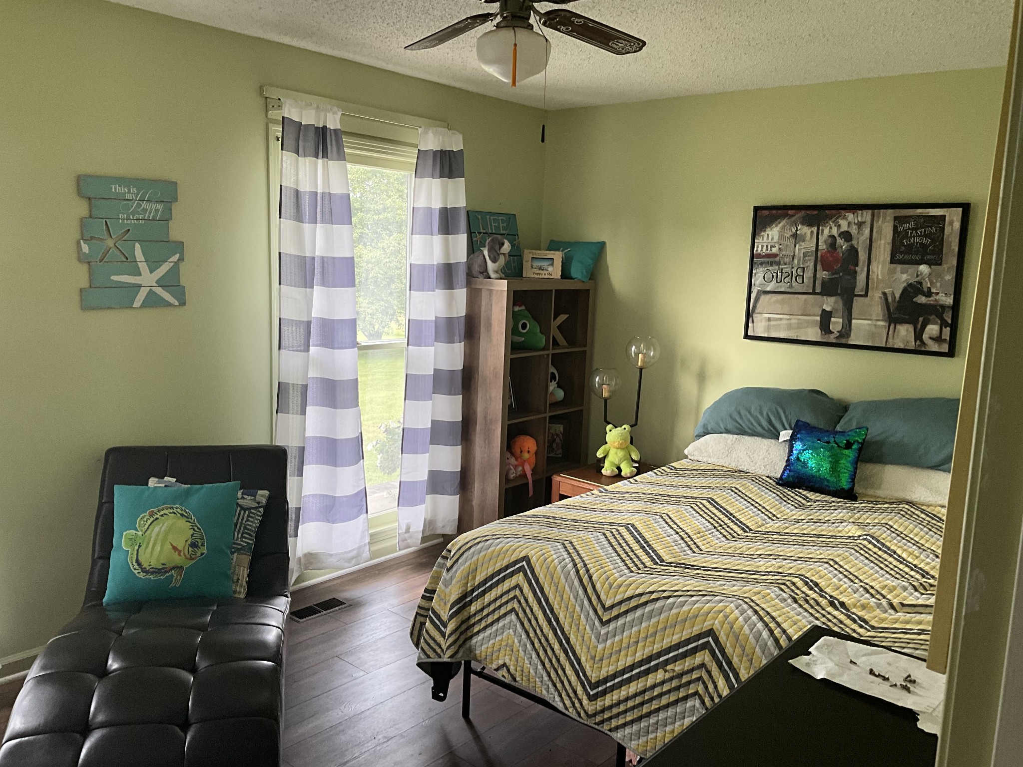 5247 Stacy Springs Road Springfield, TN 37172 - Photo 12 of 29 a bedroom with a bed and a chandelier