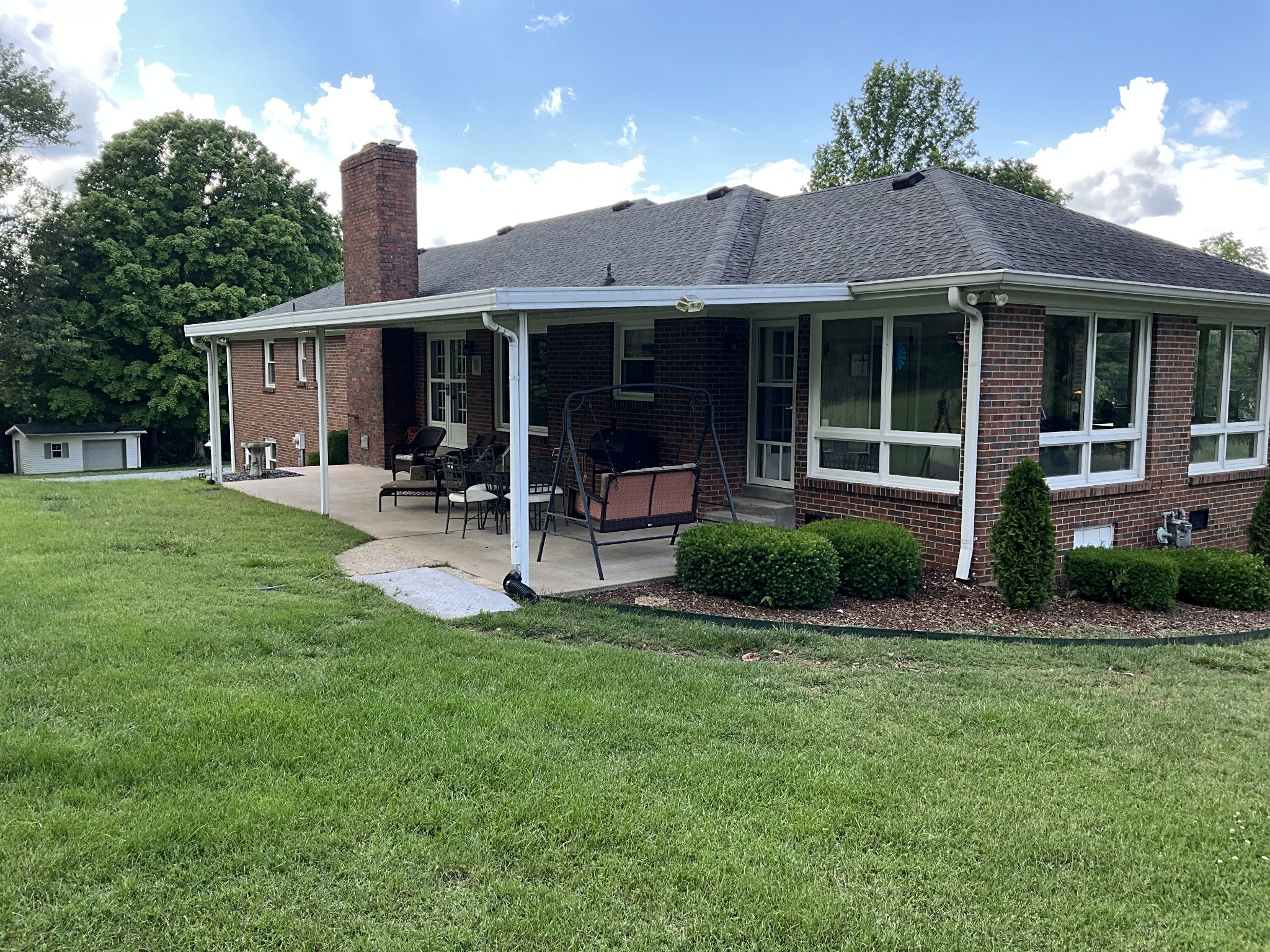 5247 Stacy Springs Road Springfield, TN 37172 - Photo 18 of 29 a front view of a house with a garden and patio
