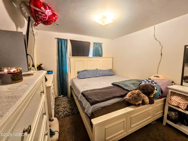 a living room with a bed and a couch