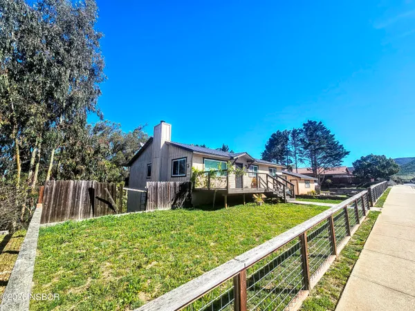 a view of a house with a yard balcony