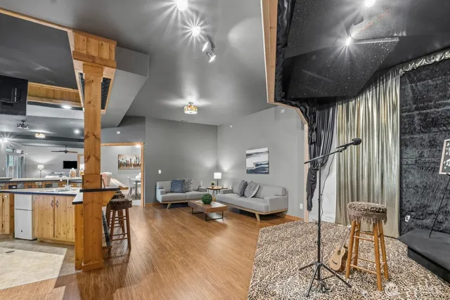 a living room with lots of furniture and a chandelier
