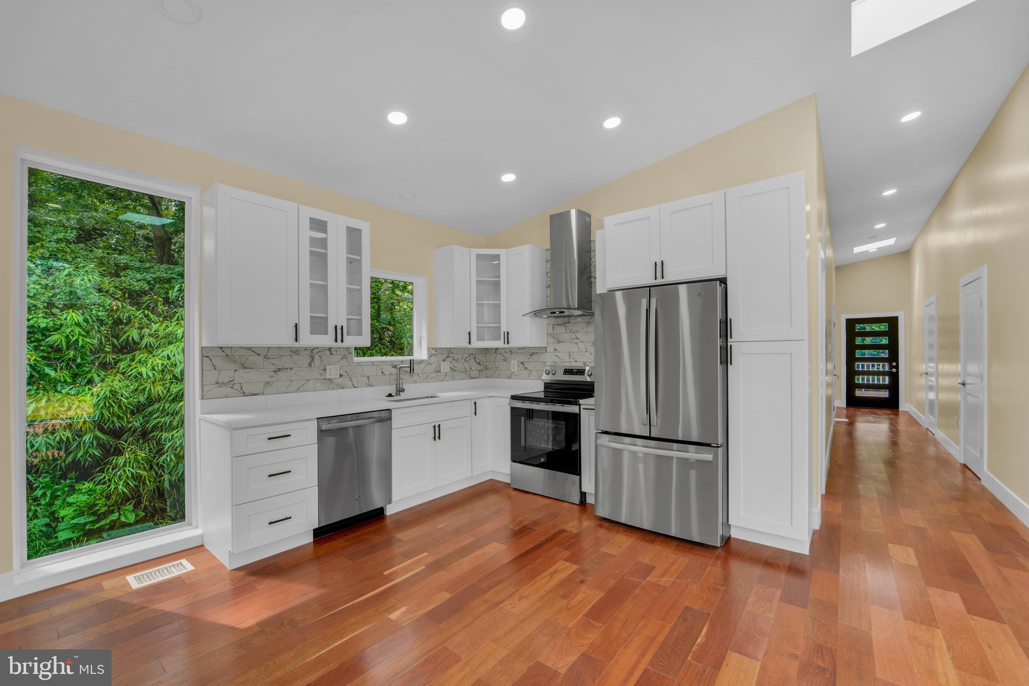 12116 Old Fort Road Fort Washington, MD 20744 - Photo 12 of 65 a kitchen with granite countertop stainless steel appliances a refrigerator and a sink