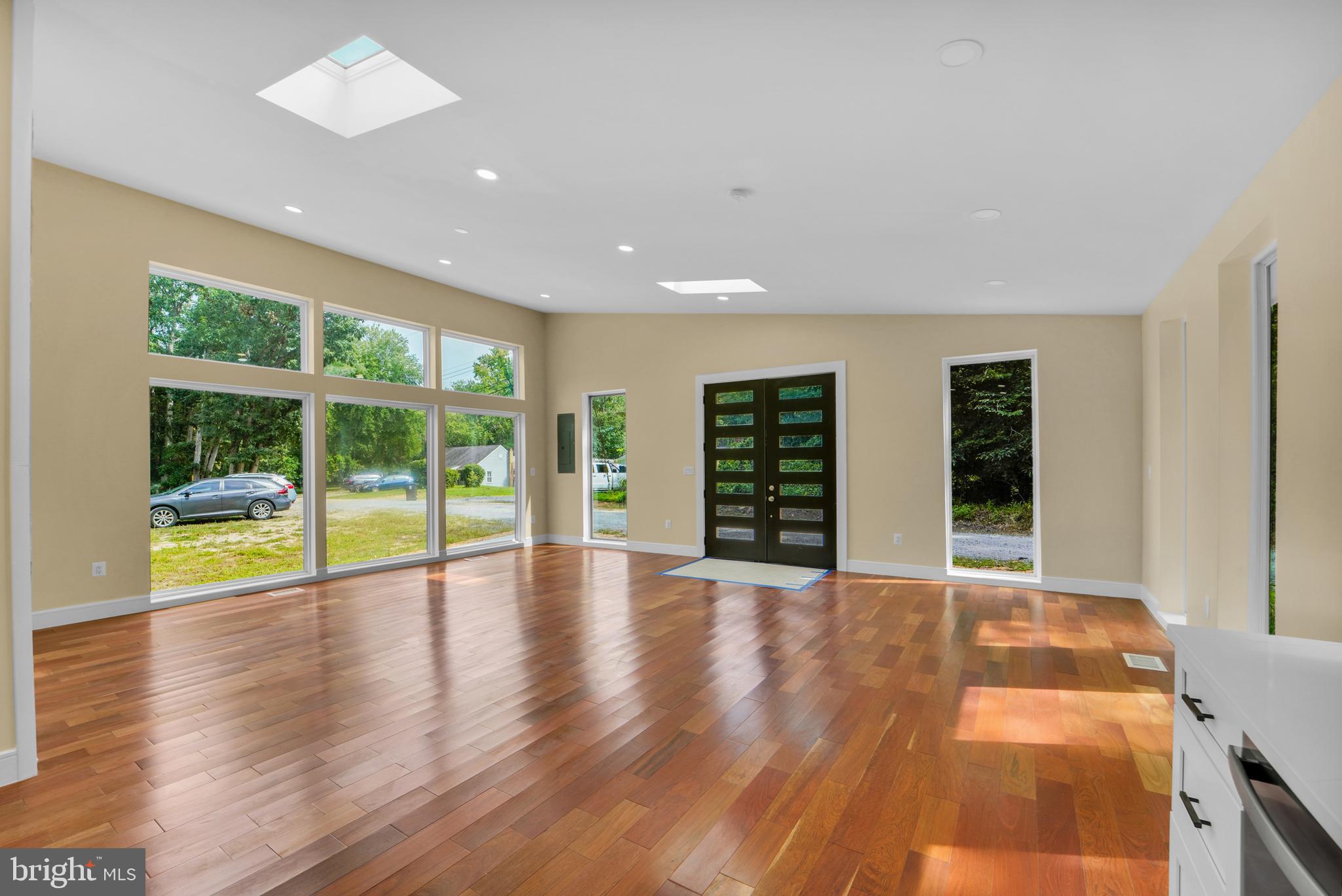 12116 Old Fort Road Fort Washington, MD 20744 - Photo 15 of 65 a view of an empty room with wooden floor and a window