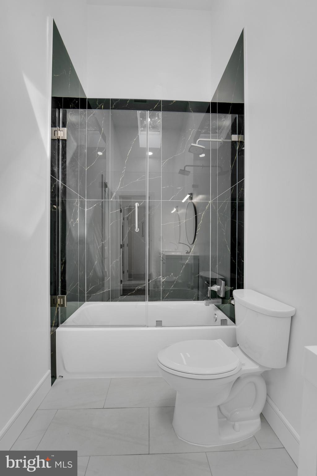 12116 Old Fort Road Fort Washington, MD 20744 - Photo 19 of 65 a bathroom with a toilet and a shower