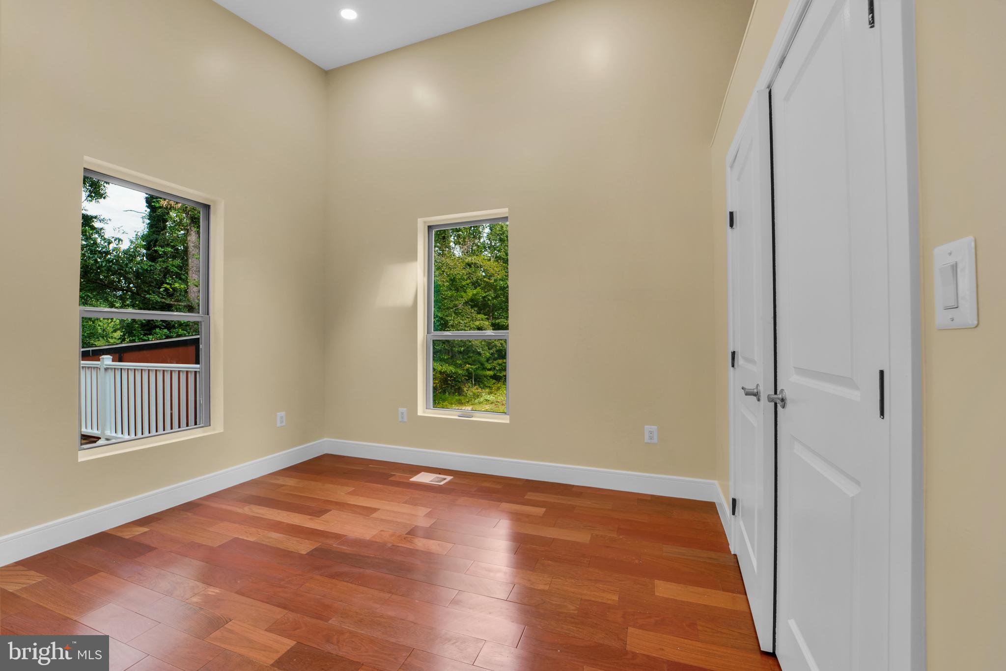 12116 Old Fort Road Fort Washington, MD 20744 - Photo 24 of 65 a view of an empty room with wooden floor and a window