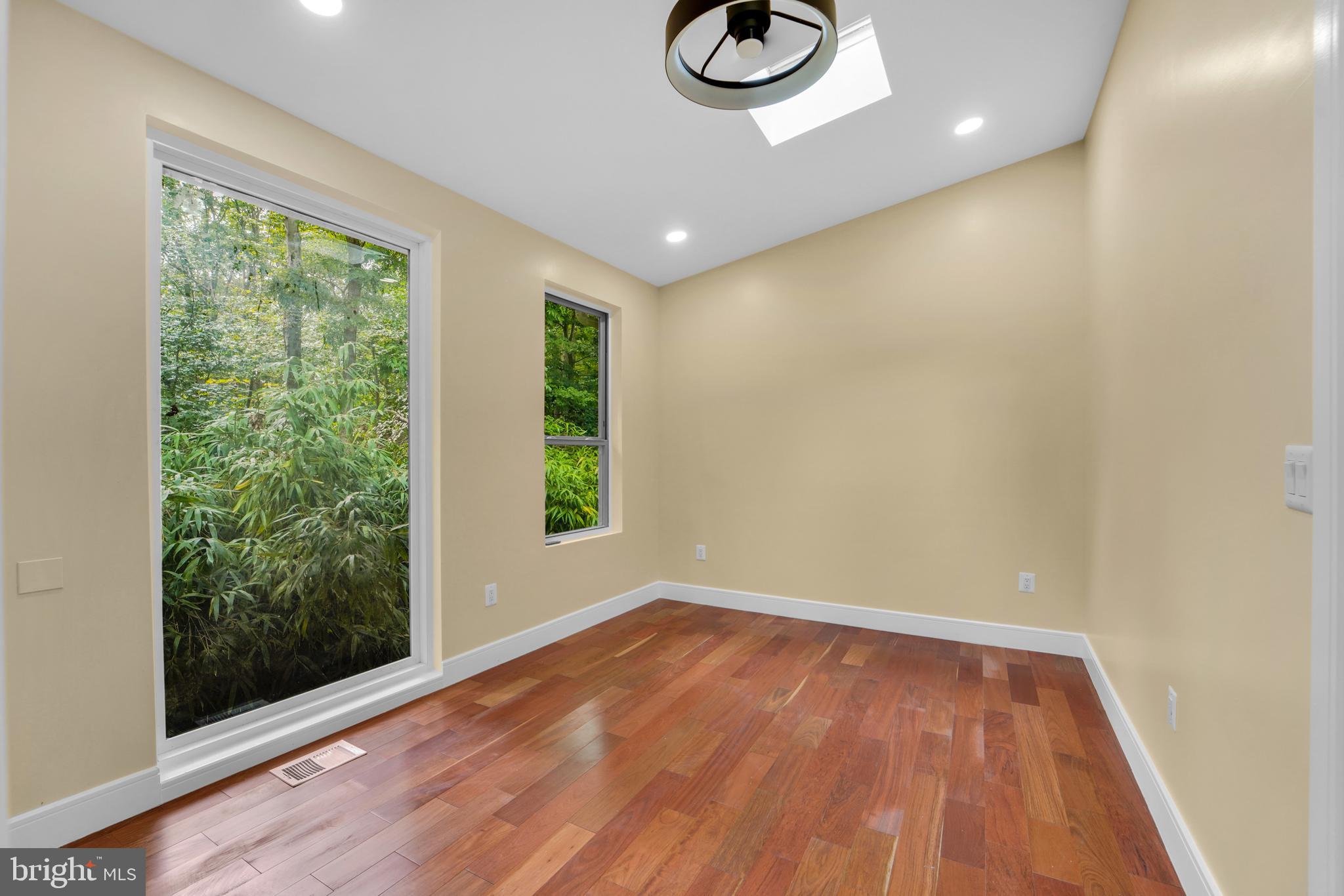 12116 Old Fort Road Fort Washington, MD 20744 - Photo 26 of 65 a view of empty room with wooden floor and fan